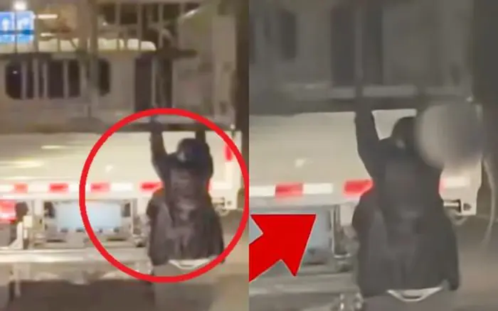 ผู้หญิงคนหนึ่งเกาะห้อยอยู่ท้ายรถบรรทุกของสามีกลางดึก ภาพที่เห็นเข้าตำตำรวจทำให้เจ้าหน